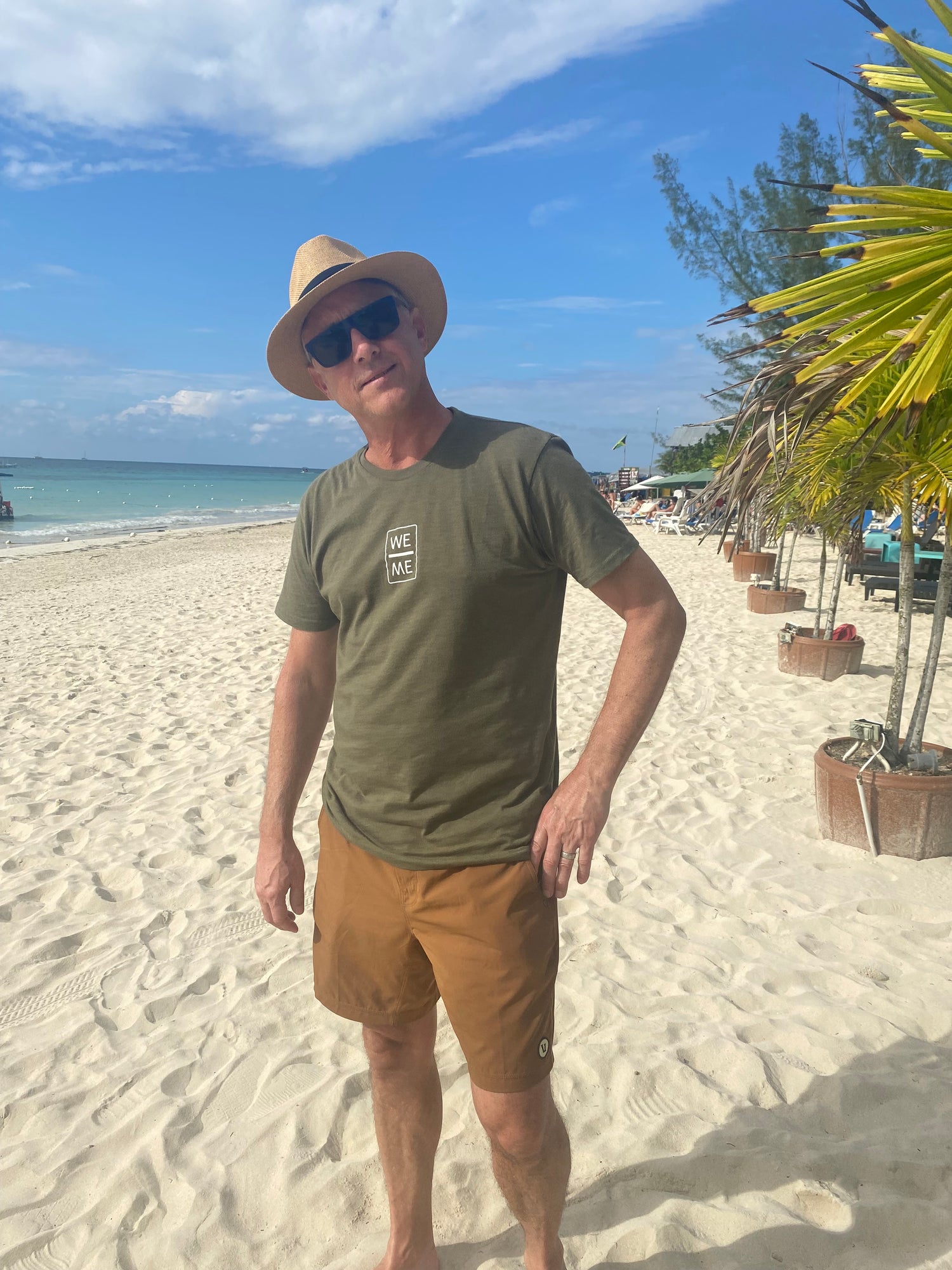 Jim is sporting a  Men's Large in Civility on a Jamaica beach by sporting a Men's Large
